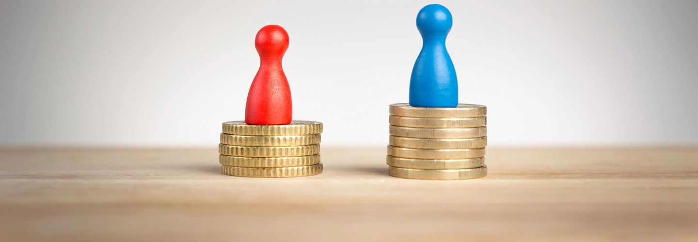 An image of two pawns -- one red symbolising women, and one blue pawn symbolising men -- both placed on top on a column of coins. The blue pawn has a bigger column, signalling more wealth.