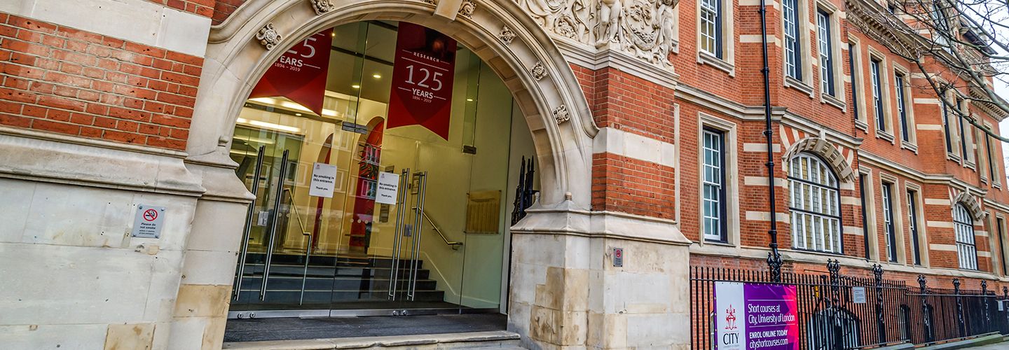 City, University of London exterior with '125 years' banners above entrance