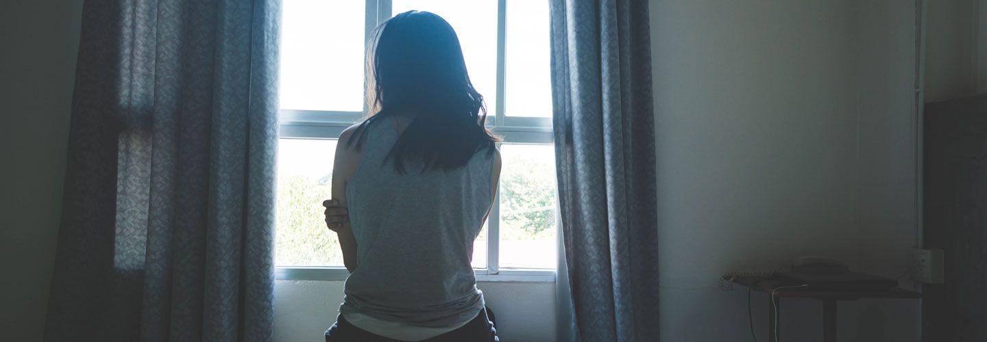 Woman looking out a window