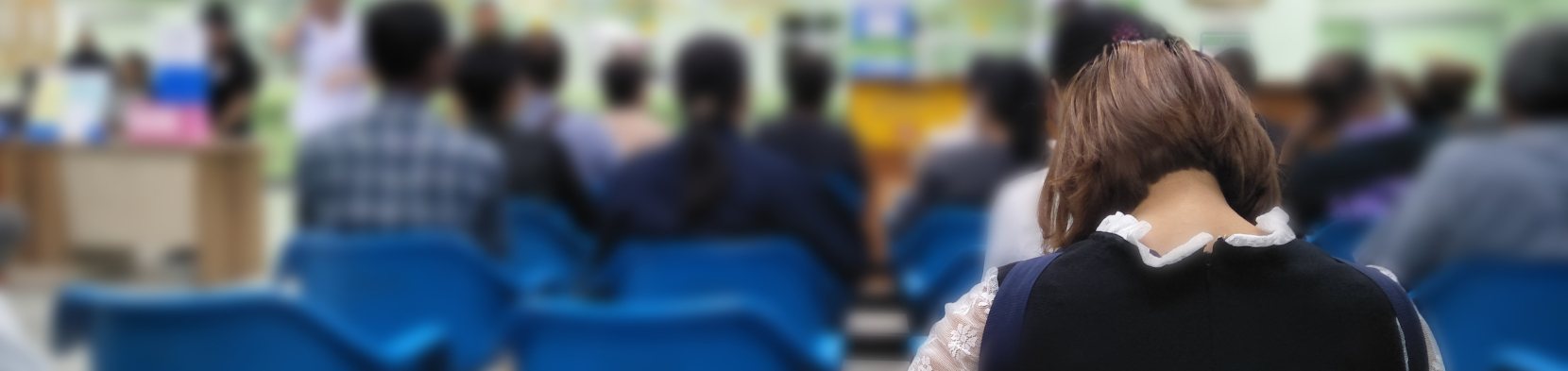 A woman waits in a hospital waiting room