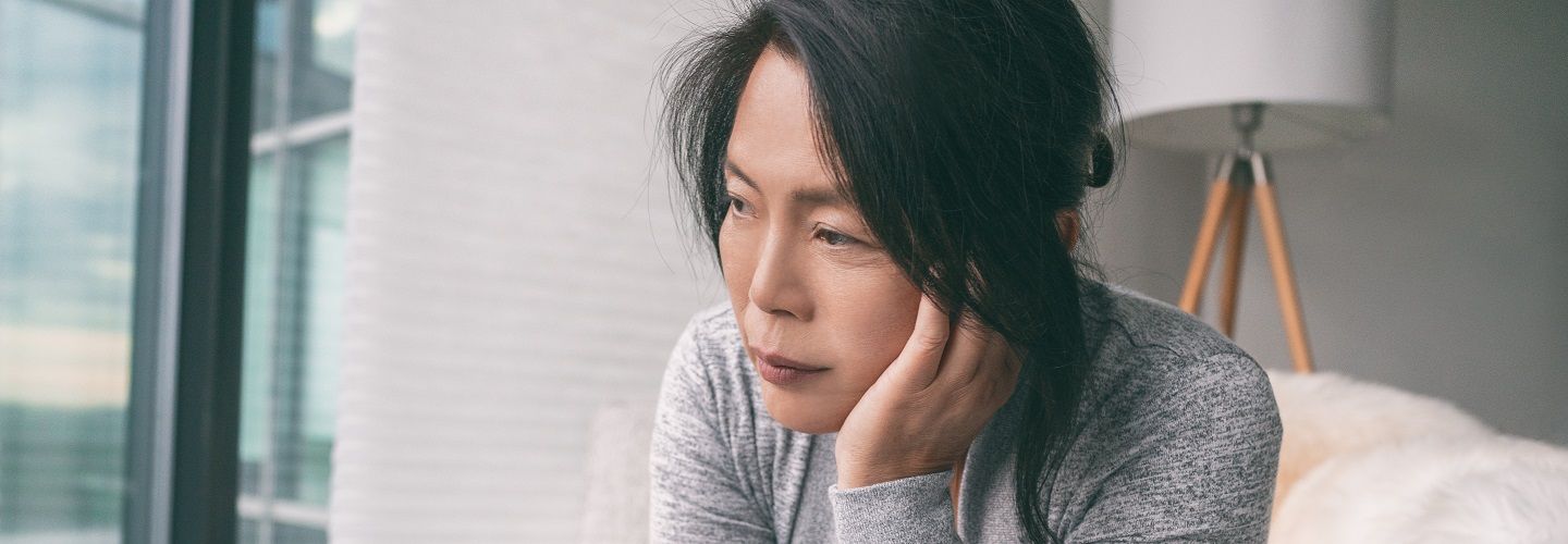 Women sitting in room appearing worried/distressed