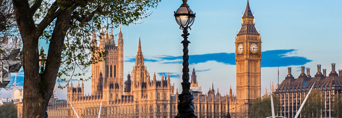 Houses of Parliament from across the river with blue winter sky