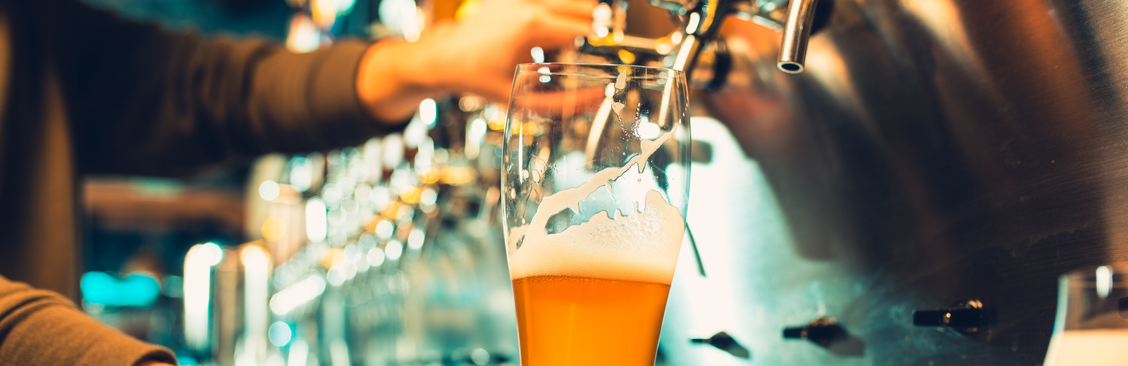 Bartender pours a pint