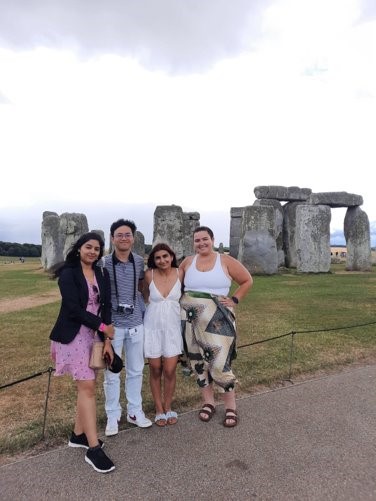 Group of young students in front of stone henge