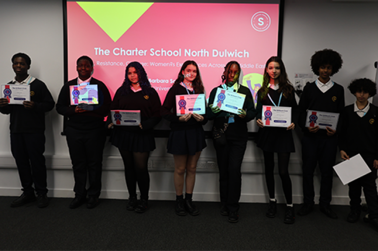 A group of school pupils pose with certificates