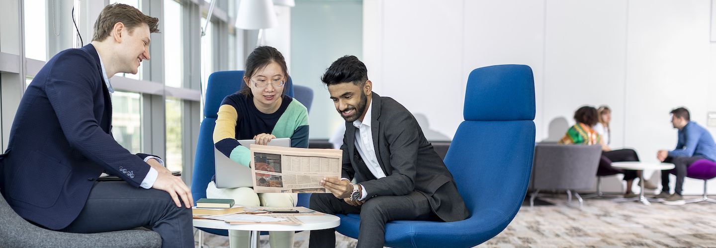 Bayes students socialising together in the MBA lounge