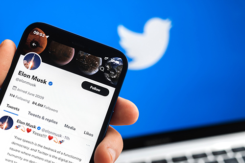 Mobile phone showing Elon Musk's Twitter profile
