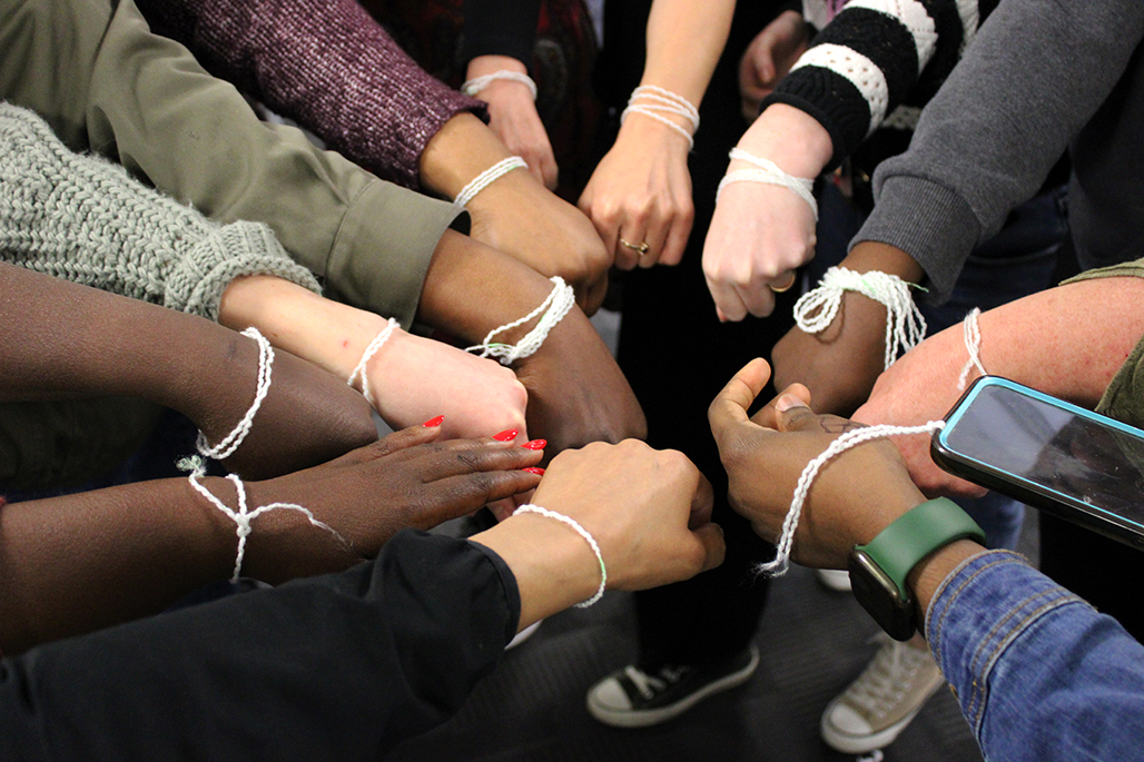 A group of women at a group care workshop demonstrating the connection they have made with each other through the use of interactive and empowering learning techniques.