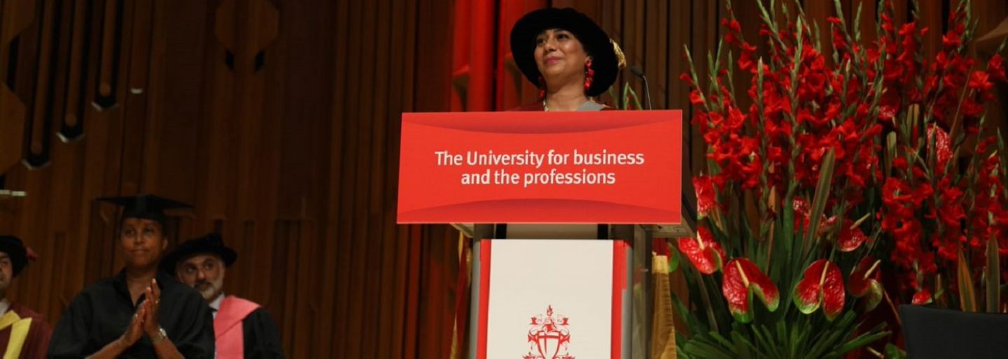 Dr Nighat Arif at the podium discussing her honorary doctorate award and advice to students