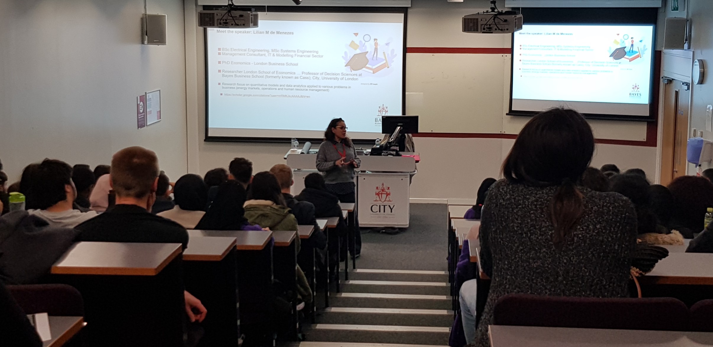 Lilian de Menezes talks to students