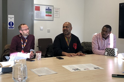 Professor Calvin Moorley speaking at a table.