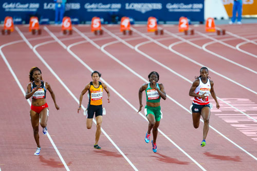 GOLD COAST, AUSTRALIA - APRIL 08, 2018: Athletic's women's 100m heats during the 2018 Gold Coast Commonwealth Games at the Carrara Stadium.