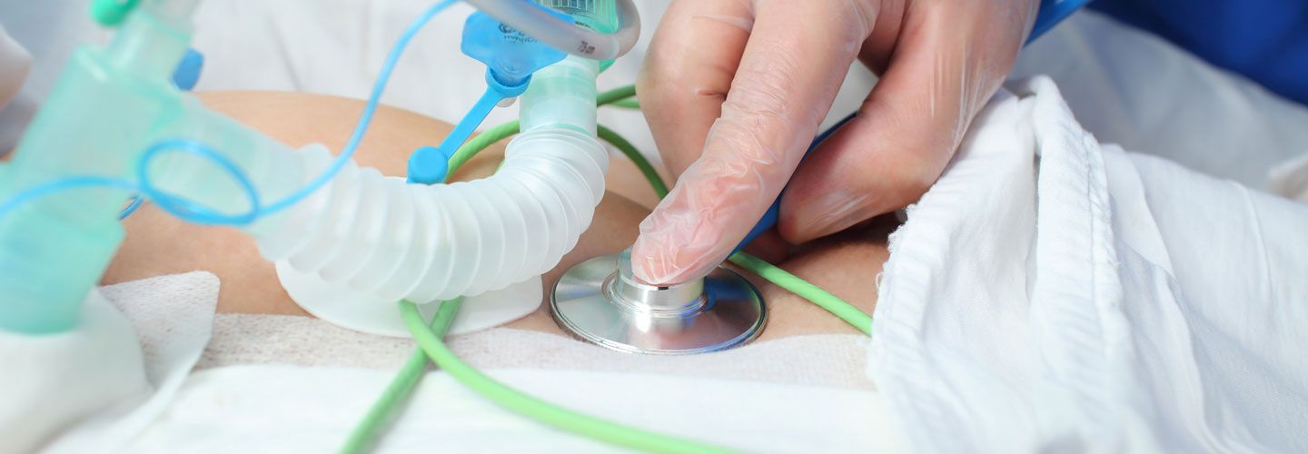Image of patient in hospital being examined with a stethoscope