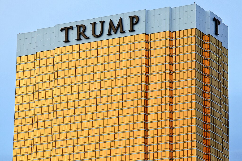 A tall building in Las Vegas with a gold effect and the word Trump at the top