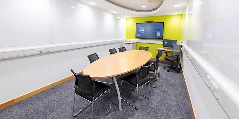Empty base teaching room with chairs positioned round a table