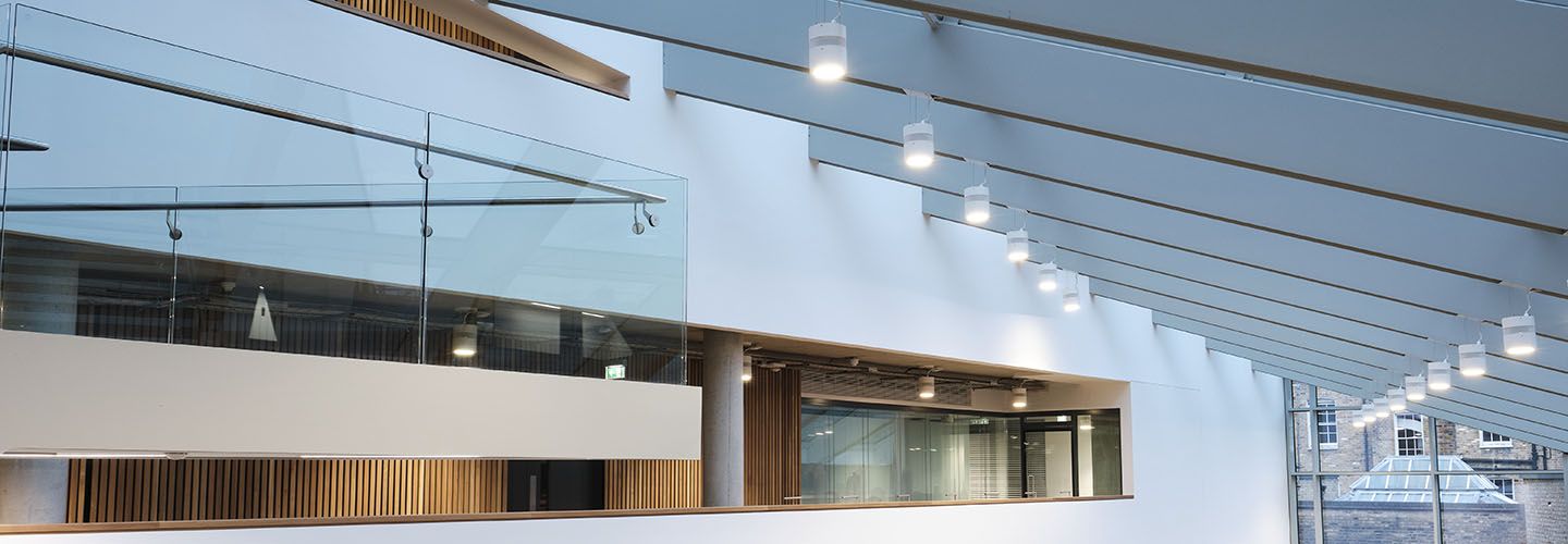 Internal of Law School building looking up to high windows and skylights.