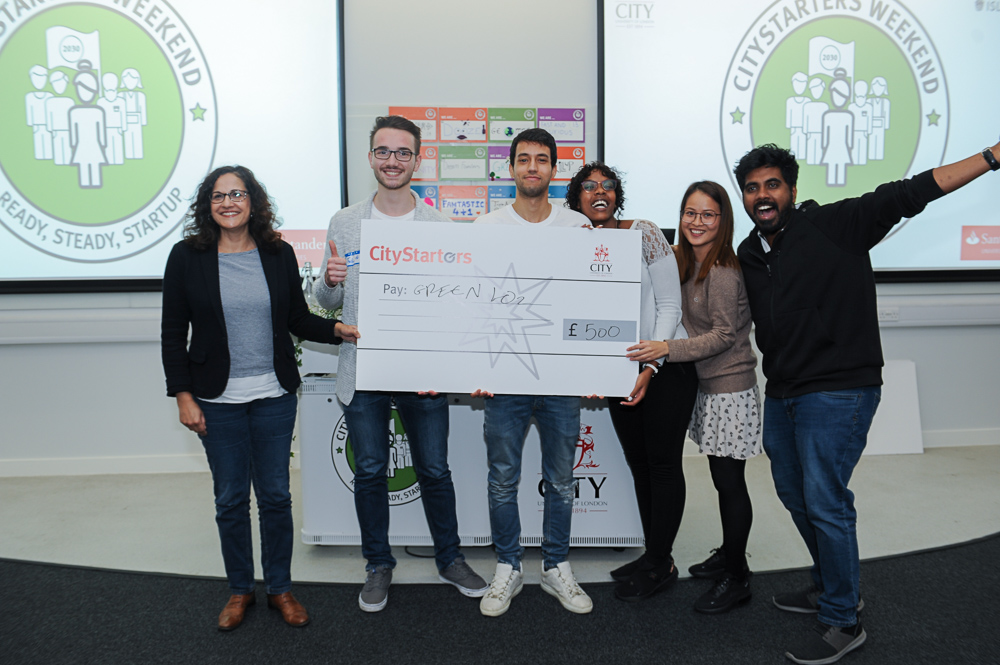 GreenLO2 team (Fabian Ronig, Mohamed Darwish, Darlene Kijemba, Miley Wei, and Lional Roy Sharon) holding their cheque presented by Cllr Asima Shaikh.