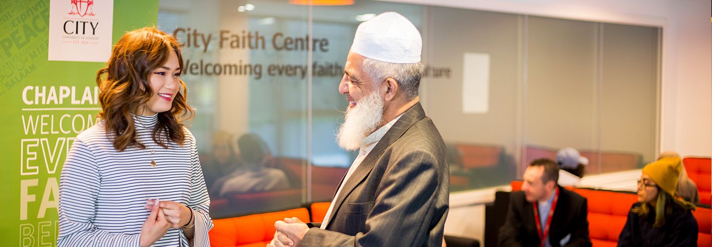 Staff talking to a student at City Faith Centre