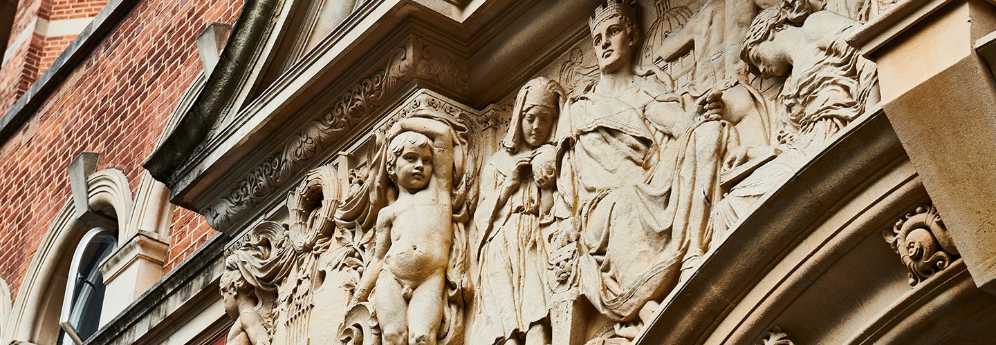 Stone sculpture above the entrance to College Building