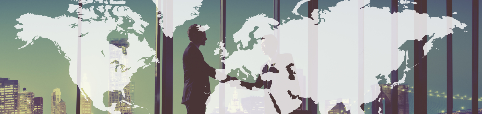 A global backdrop as two people shake hands