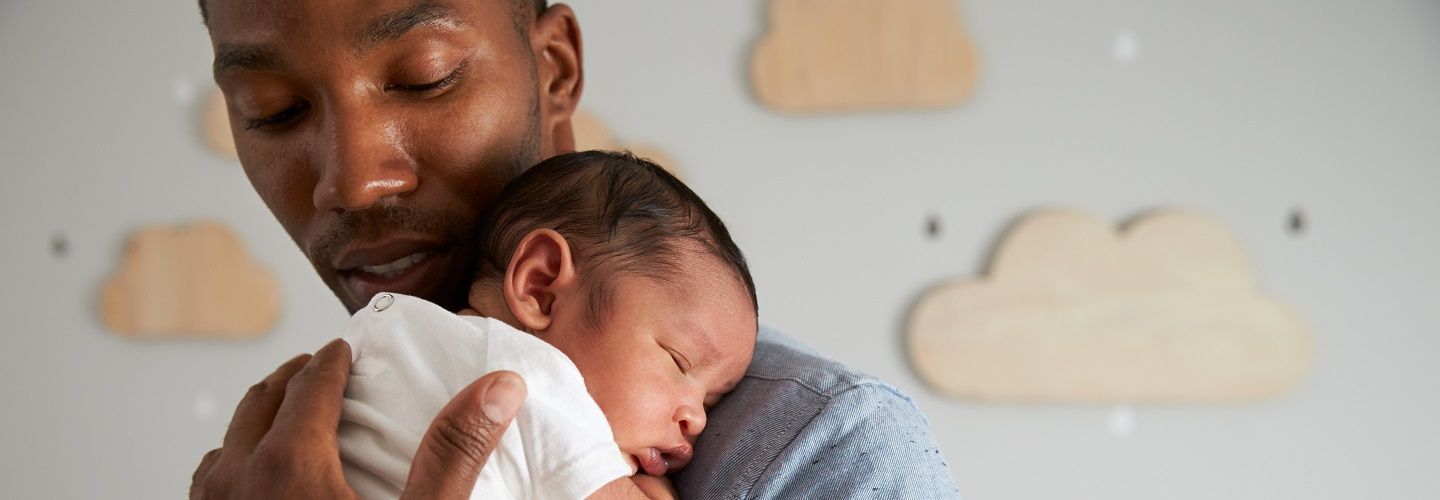 Father holding his small baby