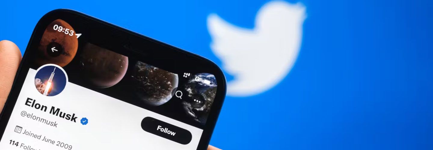 Phone with Elon Musk's Twitter account showing