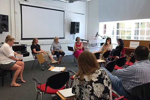 A photo of attendees in discussion