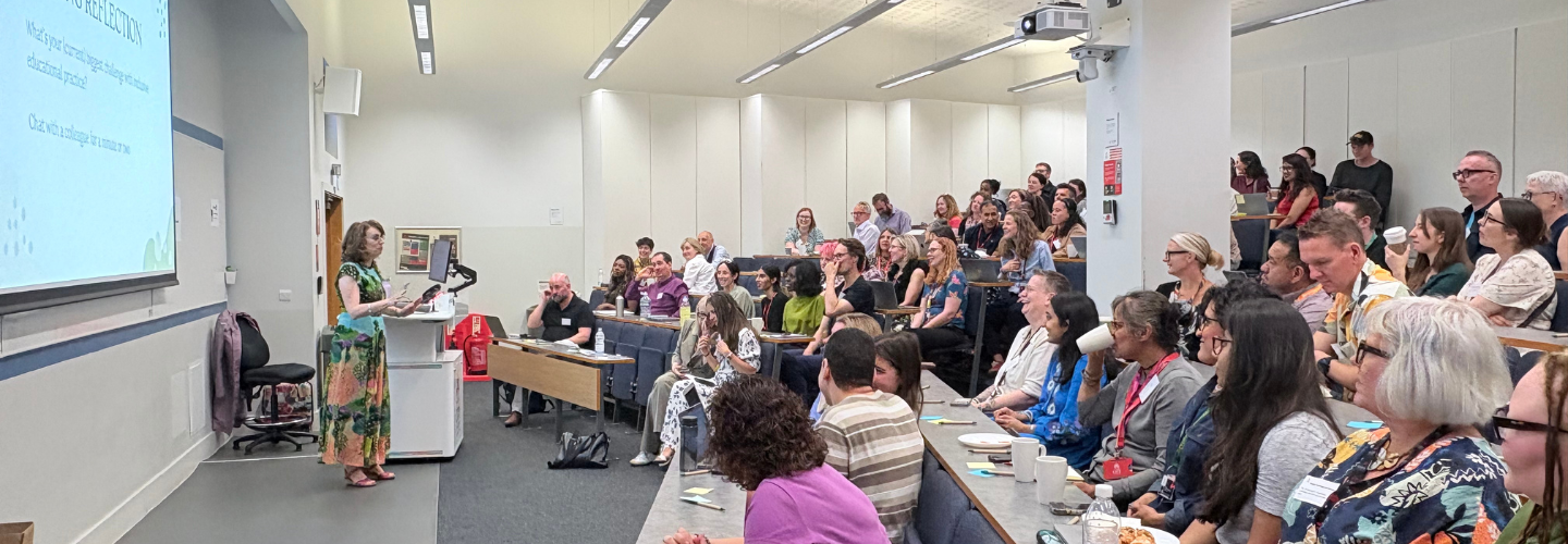 A picture of people attending the learning conference