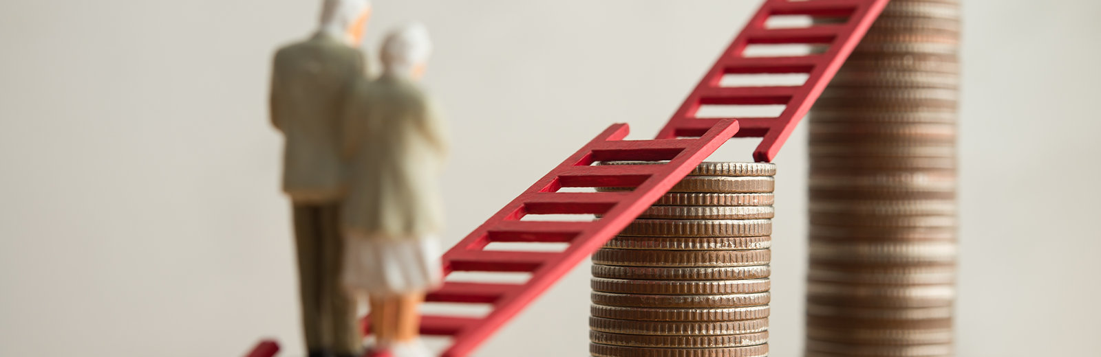 A sketch of an older man and woman walking up a ladder of coins
