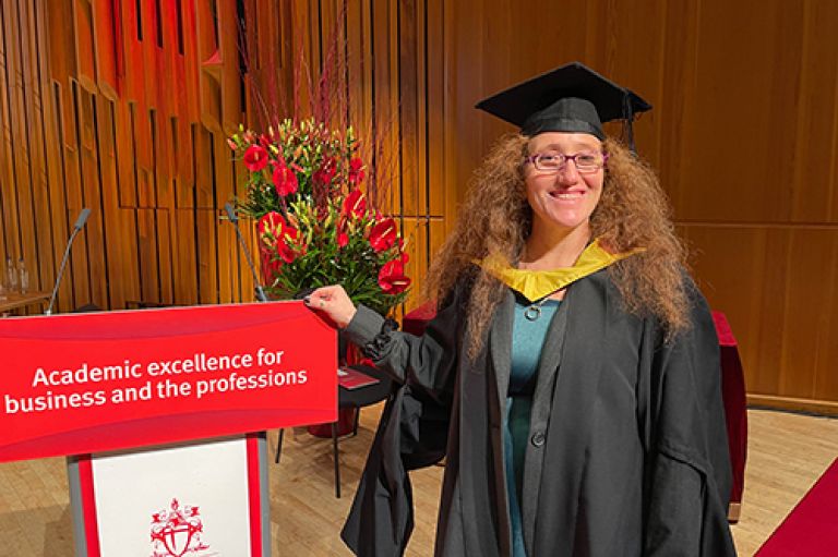 Varda Lassman Student Speaker on graduation ceremony stage