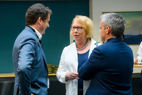 Professor Laura Empson talking with attendees