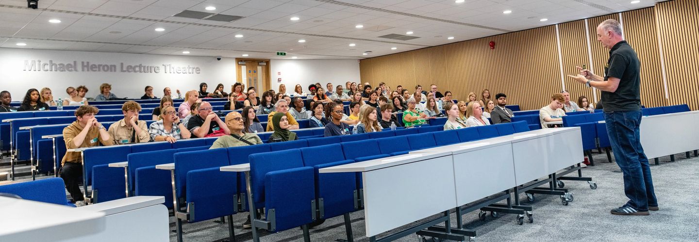 Michael Heron Lecture Theatre filled with students watching presentation