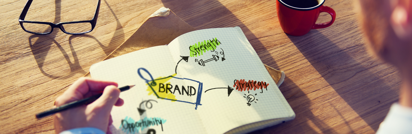 Branding man looks at a notepad
