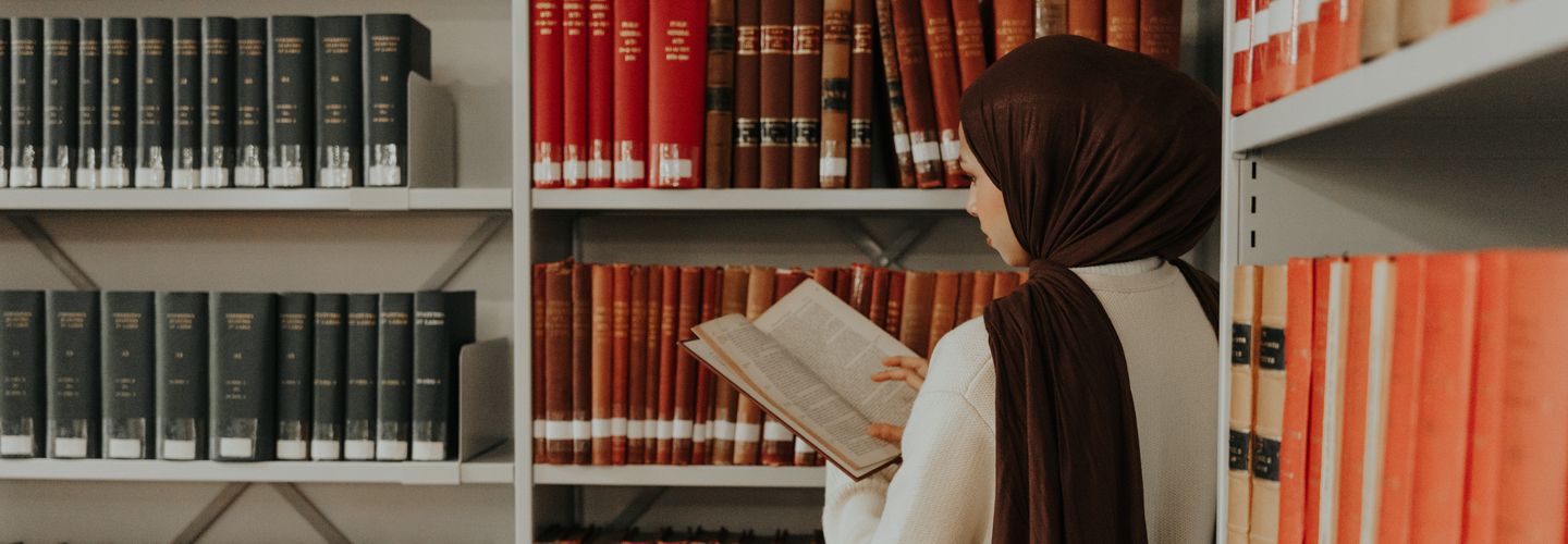 City student studying at the library