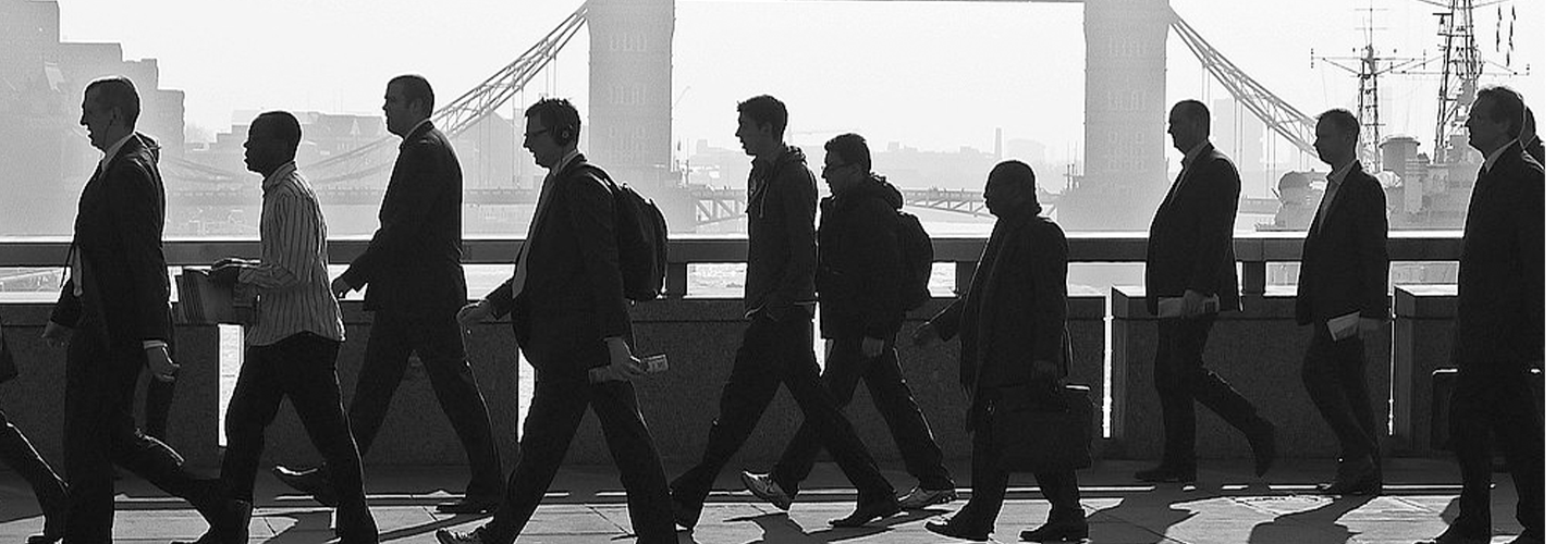 Facless workers cross bridge with Tower bridge in background