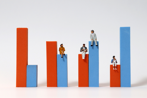 Men and women sit on a chart