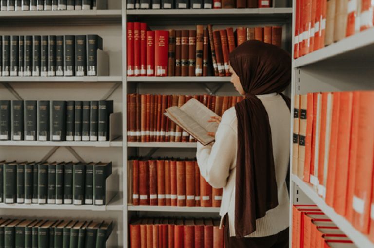 City student studying at the library