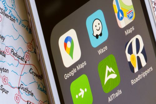 A mobile phone showing a variety of navigation apps