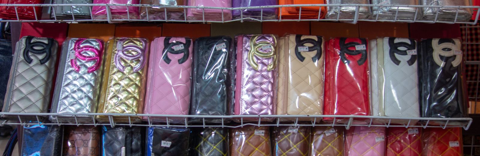 Various fake famous purse being sold openly at a market in the border of Perlis/Malaysia and Thailand