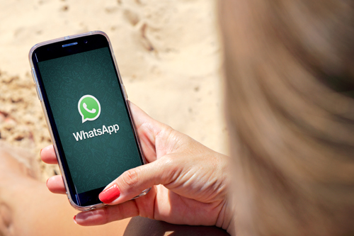 Woman with Whatsapp on her phone