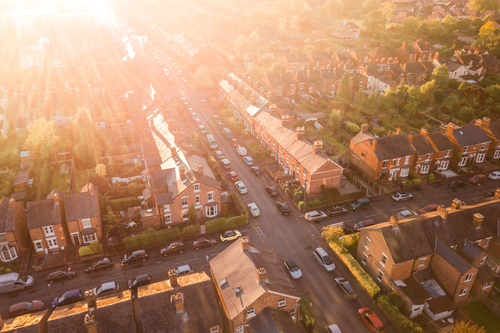Houses shine brightly under the sun