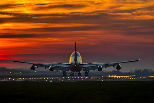 Aeroplane taking off into night sky