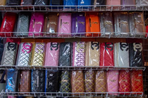 Various fake famous purses being sold openly at a market in the border of Perlis/Malaysia and Thailand