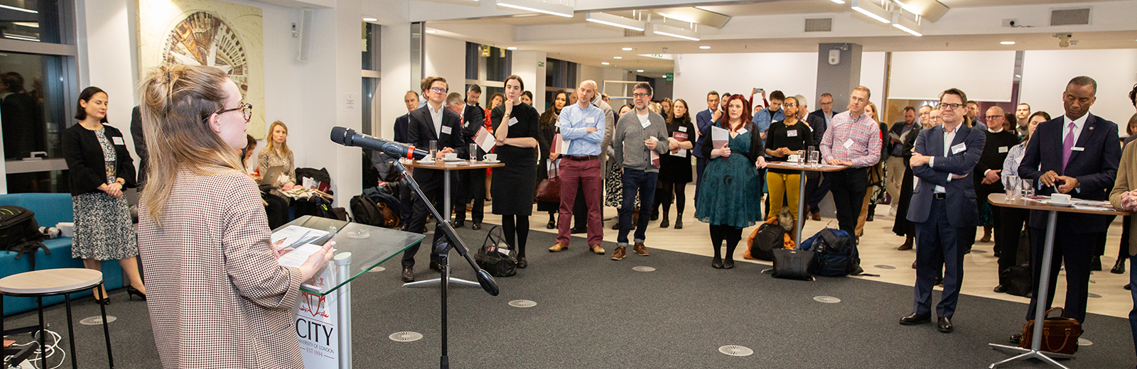 Sarah Dryden delivers her speech to an audience at the launch of her new report.
